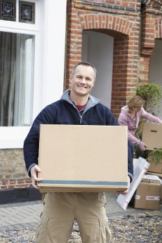 Man with a van loading items in a Shoreditch street