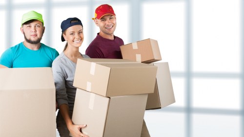 Packed office boxes and furniture ready for relocation