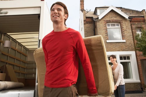 Moving staff wearing PPE while loading a van safely