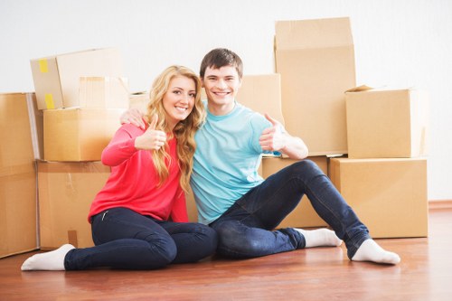 Trained movers from Shoreditch using careful lifting techniques